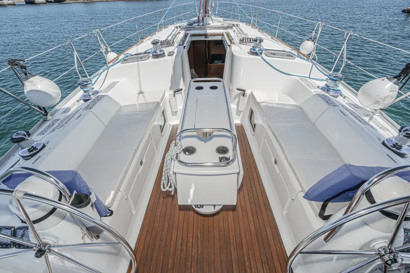 Slide: The Image of 2002 Jeanneau Sun Odyssey 43 sailboat cockpit with teak flooring and seating, docked at marina. - 35