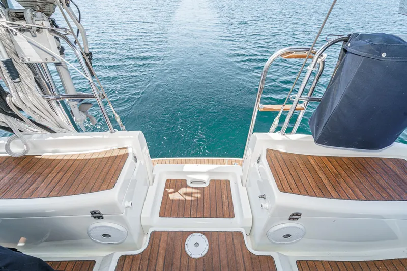 Slide: The Image of Jeanneau Sun Odyssey 43 yacht deck with wooden finish, 2002 model, overlooking the sea. - 39