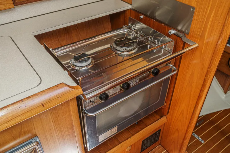 Slide: The Image of Galley kitchen in 2002 Jeanneau Sun Odyssey 43 sailboat with stove and oven. - 48