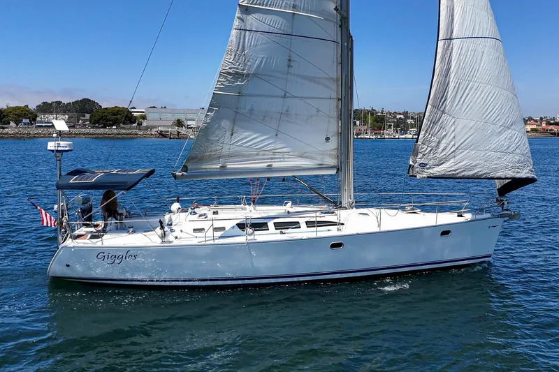 Slide: The Image of 2002 Jeanneau Sun Odyssey 43 sailboat cruising on a sunny day. - 9