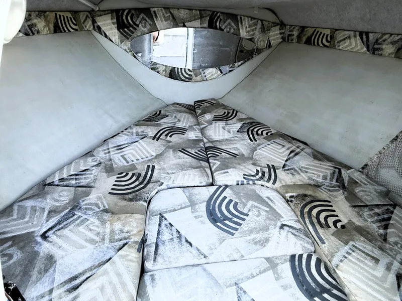 Slide: The Image of Interior cabin of 2000 Wellcraft 20 Excalibur boat with patterned cushions. - 13