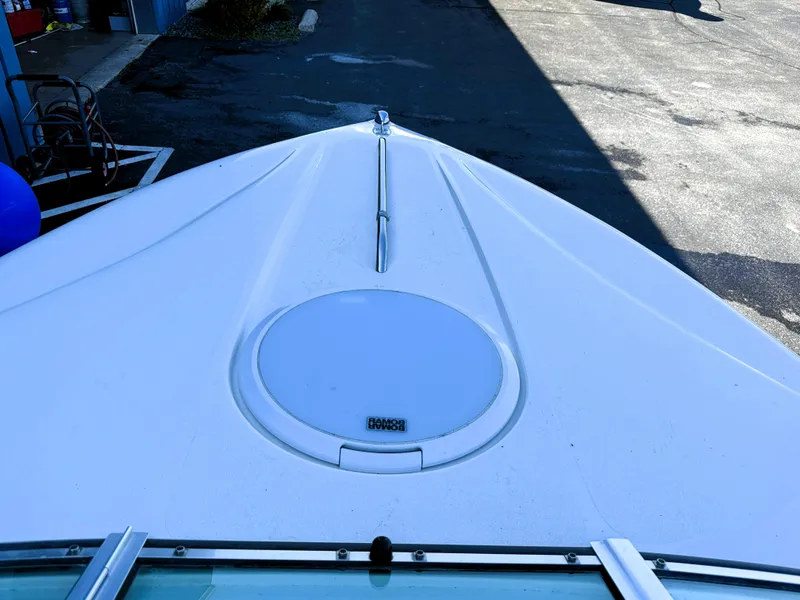 Slide: The Image of Bow of 2000 Wellcraft 20 Excalibur boat, featuring a sleek white design. - 17