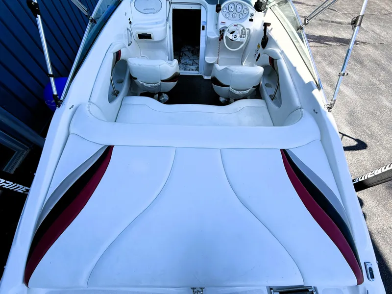 Slide: The Image of 2000 Wellcraft 20 Excalibur boat interior with white seating and dashboard. - 7