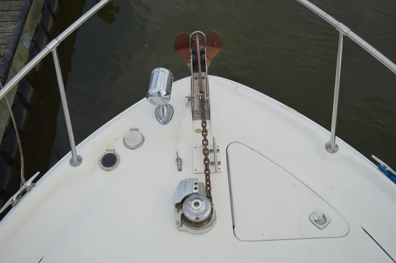 Slide: The Image of Bow of 1998 Sea Ray 310 Sundancer with anchor and chain mechanism. - 17