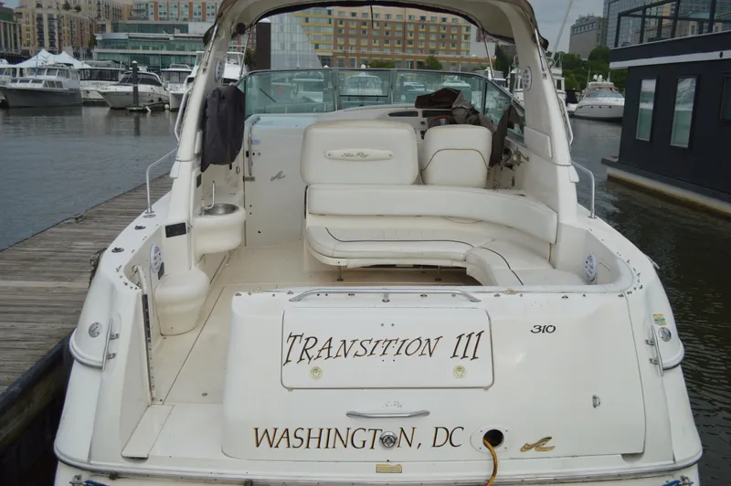 Slide: The Image of 1998 Sea Ray 310 Sundancer boat docked, named "Transition III," Washington, D.C. - 21