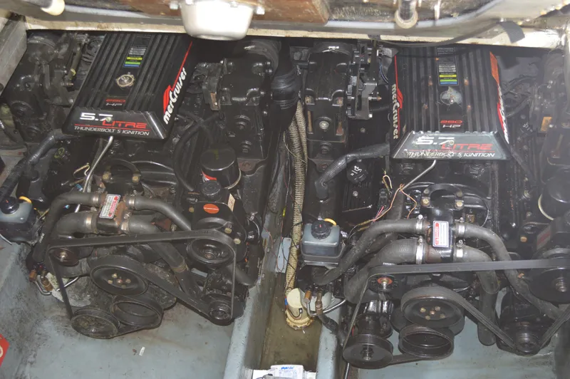 Slide: The Image of Twin MerCruiser engines in a 1998 Sea Ray 310 Sundancer boat. - 37