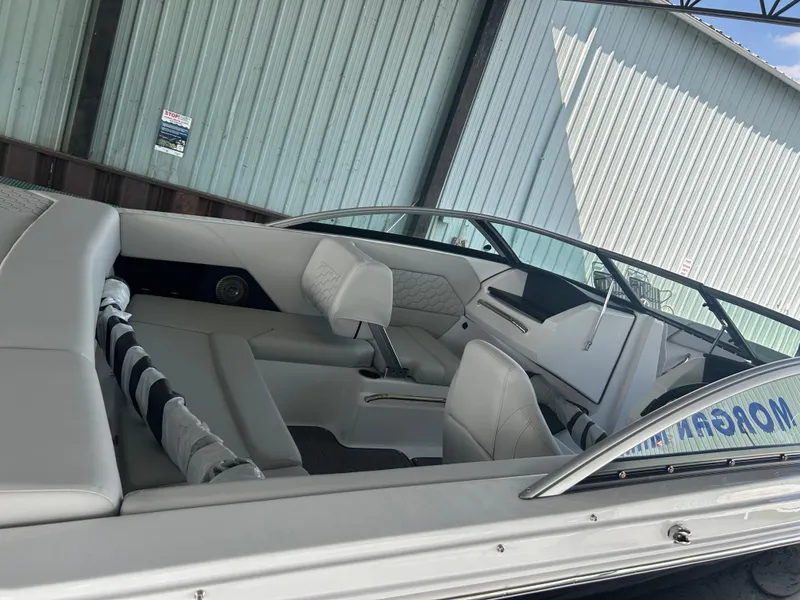 Slide: The Image of 2025 Four Winns H1 boat interior with sleek white seating and modern design. - 5