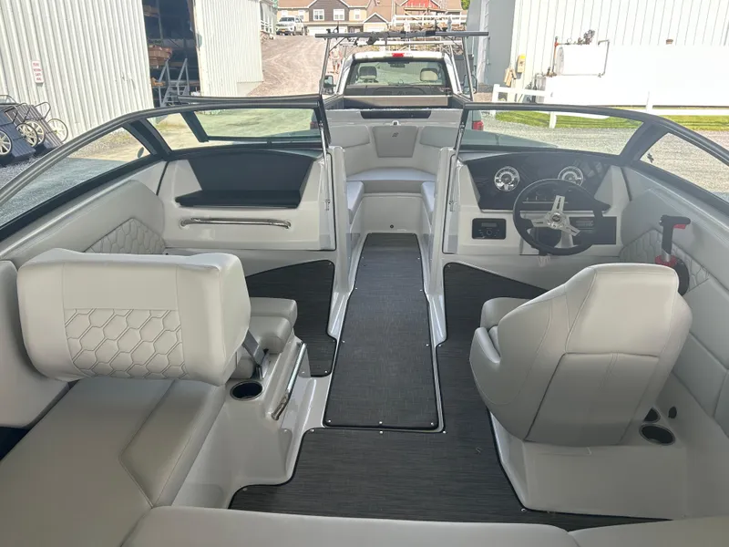 Slide: The Image of 2025 Four Winns H1 boat interior with modern seating and dashboard design. - 6