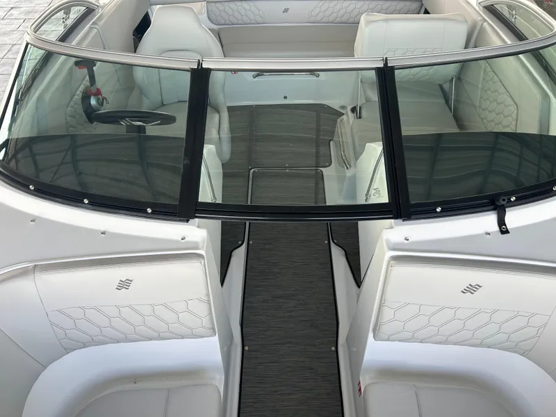 Slide: The Image of 2025 Four Winns H1 boat interior with sleek seating and modern design. - 8