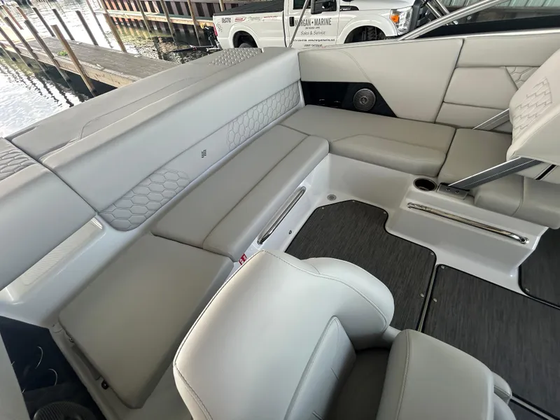 Slide: The Image of 2025 Four Winns H1 boat interior with luxurious gray seating and modern design. - 9