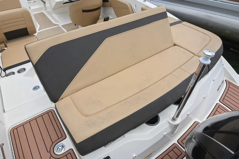 Slide: The Image of 2018 Sea Ray SPX 210 Outboard boat interior with tan and black seating. - 12