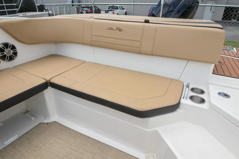Slide: The Image of 2018 Sea Ray SPX 210 Outboard boat interior with tan seating and cup holders. - 14