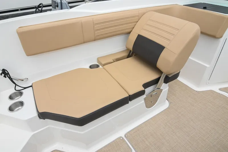 Slide: The Image of 2018 Sea Ray SPX 210 Outboard boat seat with tan and black upholstery. - 18