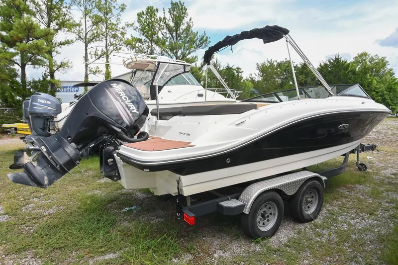 Slide: The Image of 2018 Sea Ray SPX 210 Outboard boat on trailer, parked outdoors. - 2