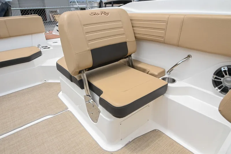Slide: The Image of 2018 Sea Ray SPX 210 Outboard boat interior with tan seating and speaker. - 21