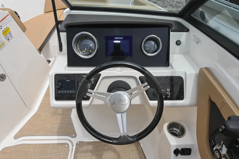 Slide: The Image of 2018 Sea Ray SPX 210 Outboard dashboard with steering wheel and instrument panel. - 25