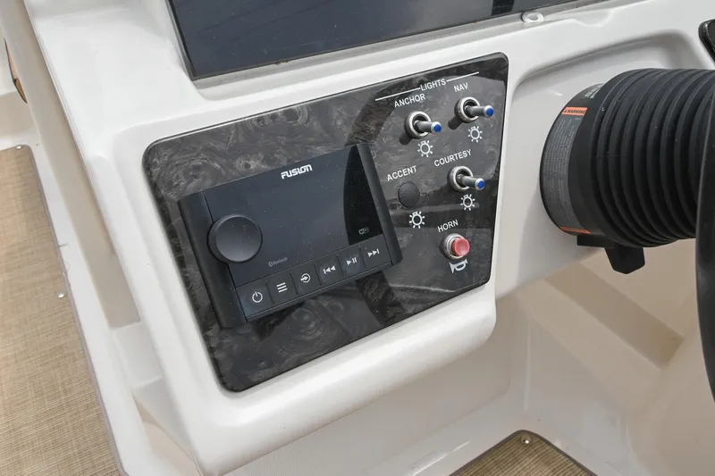 Slide: The Image of Control panel of 2018 Sea Ray SPX 210 Outboard with Fusion audio system and switches. - 26
