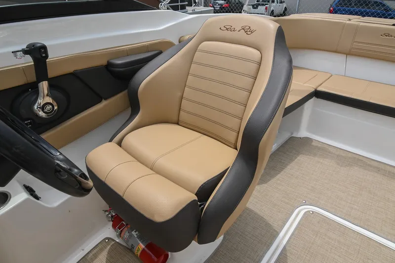 Slide: The Image of 2018 Sea Ray SPX 210 Outboard boat interior with tan and black seating. - 27