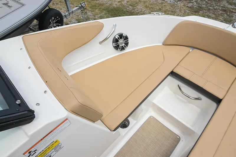Slide: The Image of 2018 Sea Ray SPX 210 Outboard boat interior with tan seating and speaker. - 30