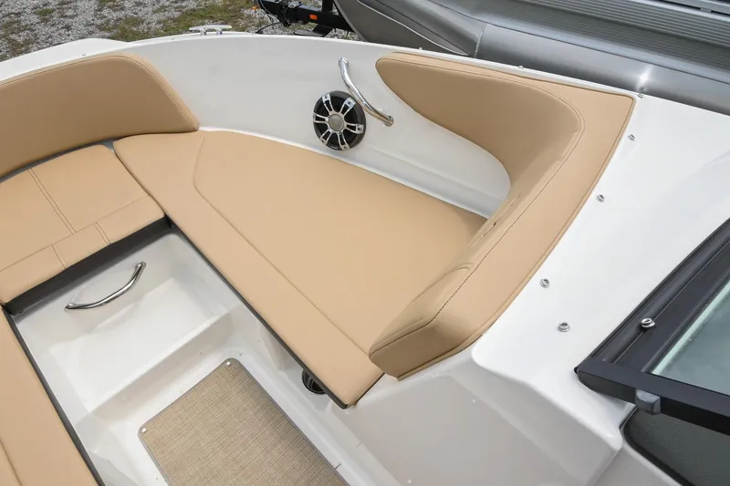 Slide: The Image of 2018 Sea Ray SPX 210 Outboard boat interior with tan seating and speaker. - 32