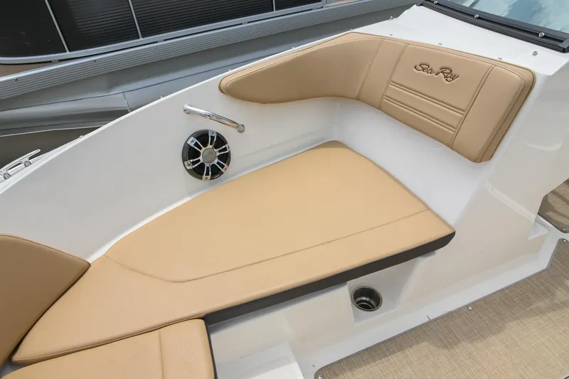Slide: The Image of 2018 Sea Ray SPX 210 Outboard boat interior with tan seating and speaker. - 33