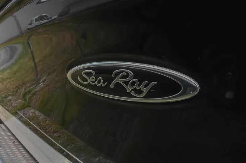 Slide: The Image of Sea Ray logo on 2018 SPX 210 Outboard boat, black exterior detail. - 5