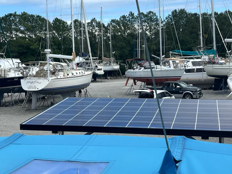 Slide: The Image of Boats in a marina with a 2000 Catalina 36 Mk II sailboat and solar panels in the foreground. - 10