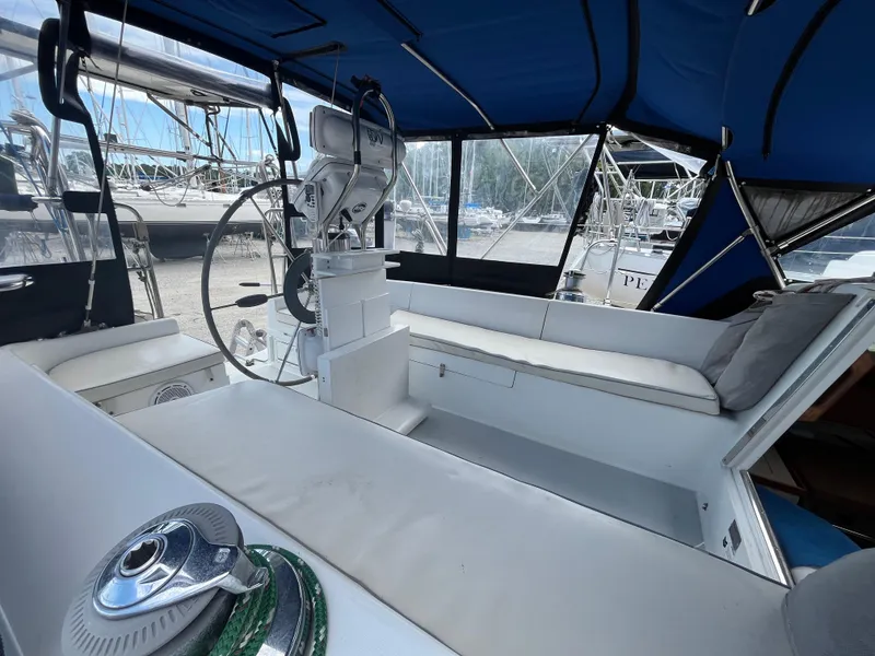 Slide: The Image of Cockpit of 2000 Catalina 36 Mk II sailboat with blue canopy and steering wheel. - 11