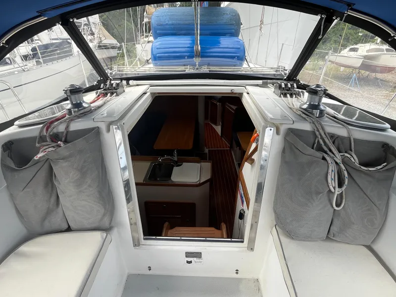 Slide: The Image of Interior view of a 2000 Catalina 36 Mk II sailboat cockpit with open cabin entrance. - 12