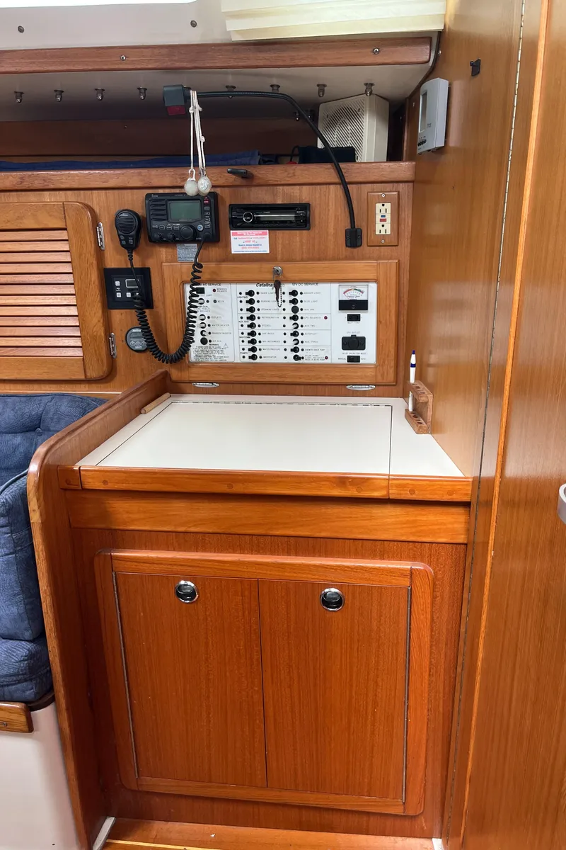 Slide: The Image of Navigation station in a 2000 Catalina 36 Mk II sailboat with control panel and radio equipment. - 17