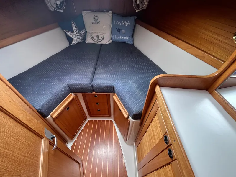 Slide: The Image of Cozy cabin interior of 2000 Catalina 36 Mk II sailboat with wooden finish and cushions. - 19