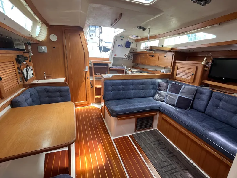 Slide: The Image of Interior of 2000 Catalina 36 Mk II sailboat with wood finish and blue upholstery. - 21