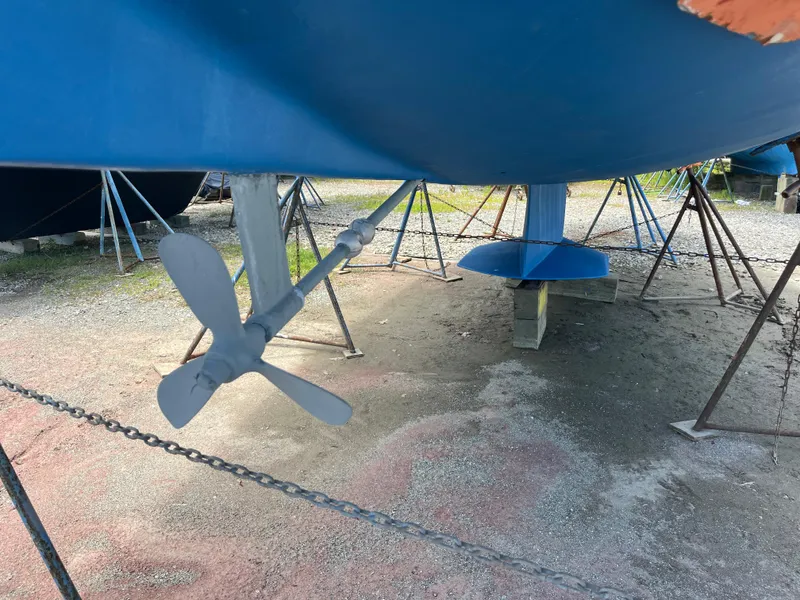Slide: The Image of Catalina 36 Mk II sailboat propeller and keel, 2000 model, on stands for maintenance. - 3
