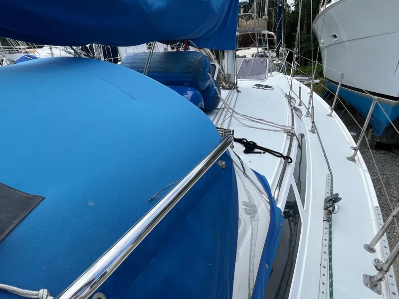 Slide: The Image of 2000 Catalina 36 Mk II sailboat with blue covers and deck view. - 8