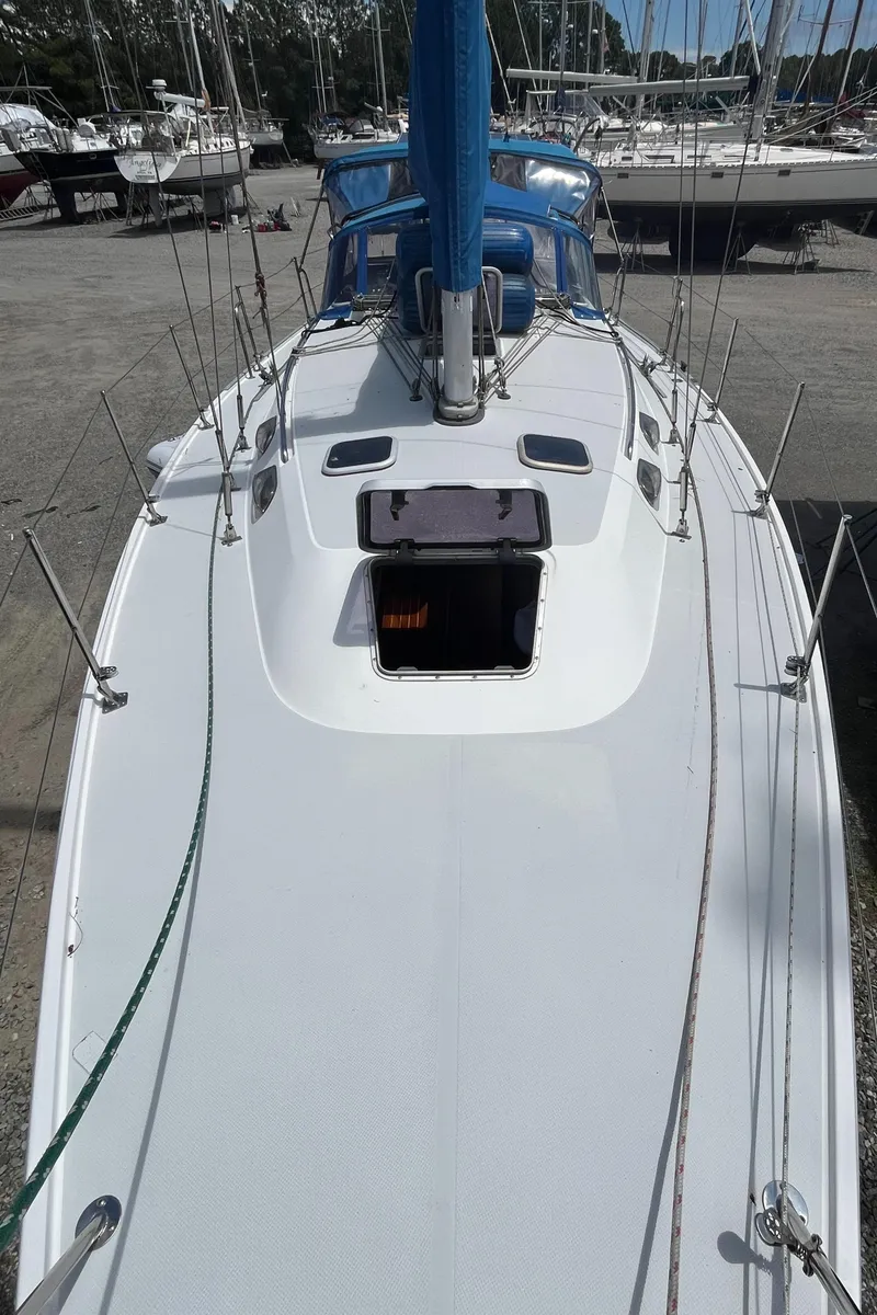 Slide: The Image of 2000 Catalina 36 Mk II sailboat on land, showing deck and open hatch. - 9