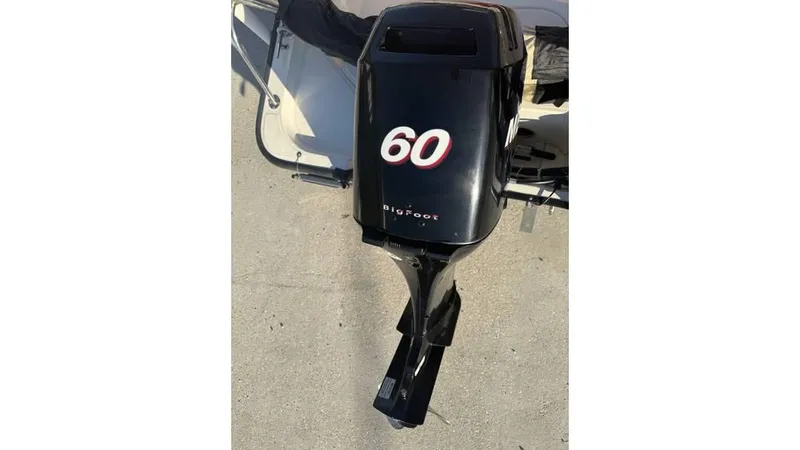 Slide: The Image of Outboard motor on a 2007 Boston Whaler 150 Montauk boat. - 9