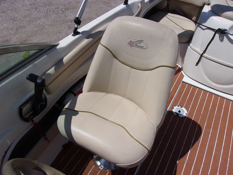 Slide: The Image of Beige captain's chair in 2000 Sea Ray 180 Bow Rider boat interior. - 8
