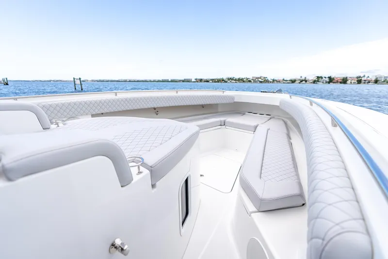 Slide: The Image of 2024 HCB 42 Lujo boat interior with luxurious seating and ocean view. - 10