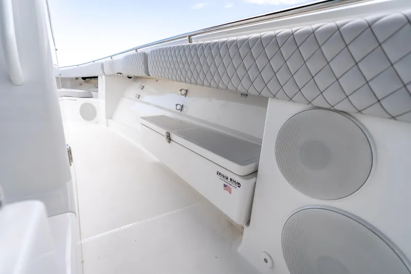 Slide: The Image of 2024 HCB 42 Lujo boat interior with cushioned seating and storage. - 13