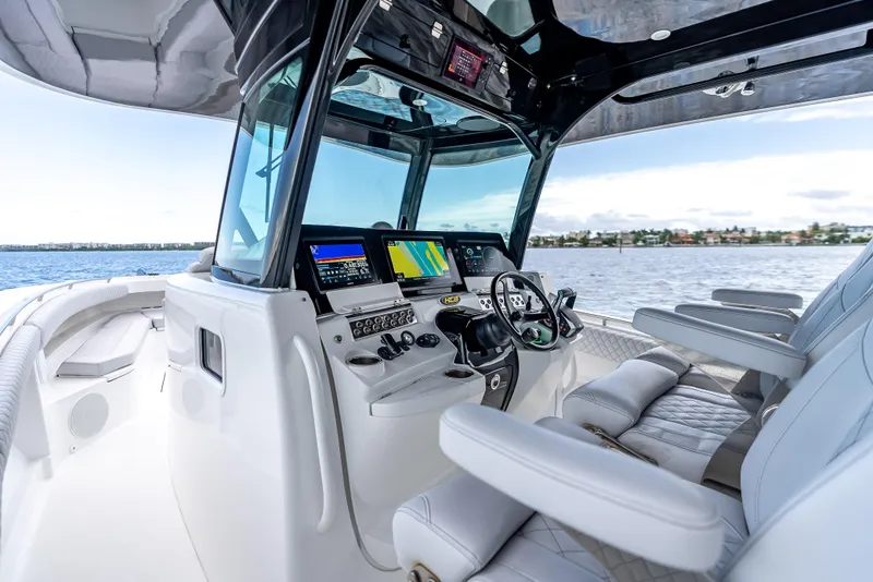 Slide: The Image of 2024 HCB 42 Lujo boat cockpit with advanced navigation systems and luxurious seating. - 18