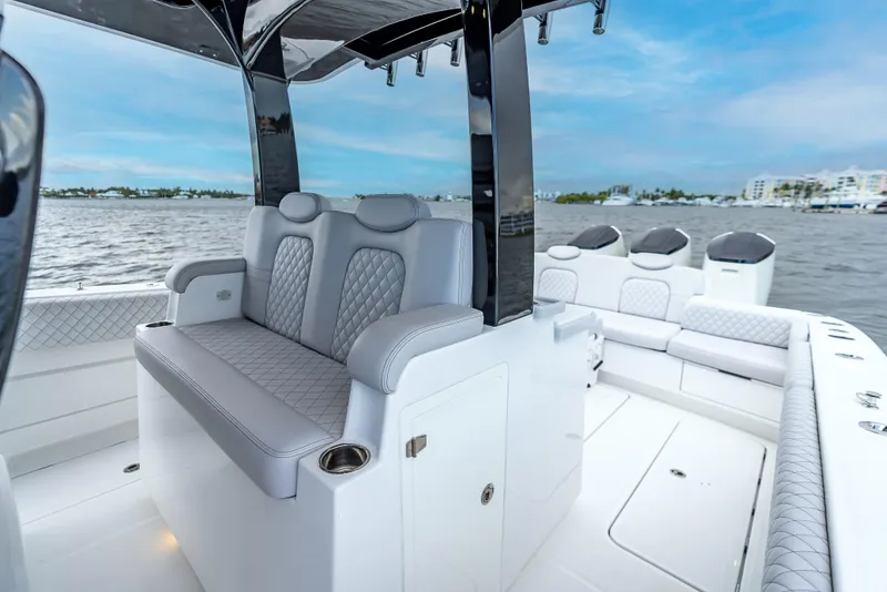 Slide: The Image of 2024 HCB 42 Lujo luxury boat interior with plush seating and sleek design on the water. - 19