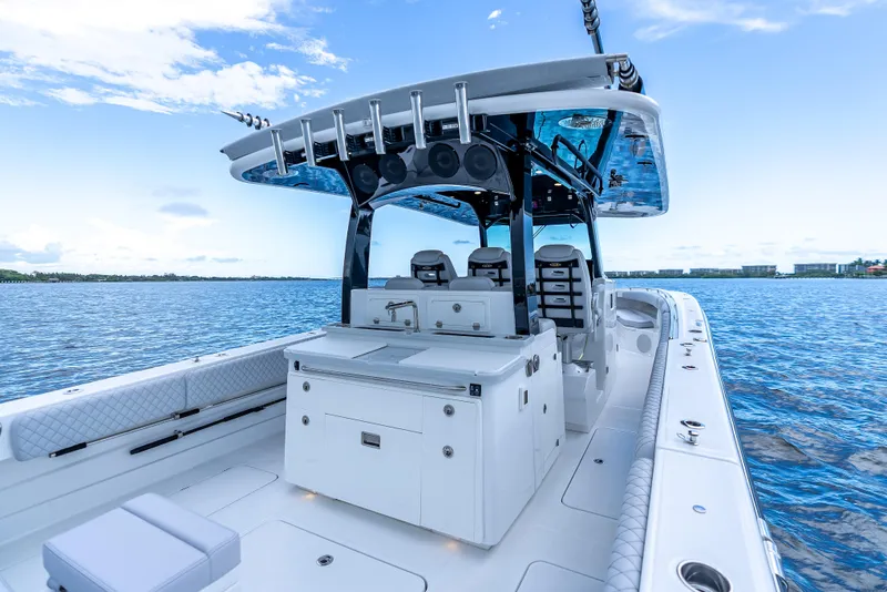 Slide: The Image of 2024 HCB 42 Lujo boat on water, featuring sleek design and modern amenities. - 21