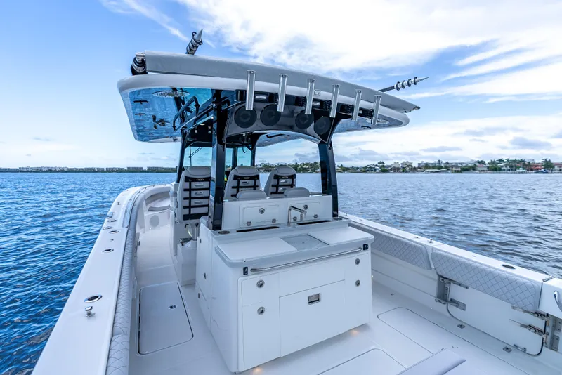 Slide: The Image of 2024 HCB 42 Lujo boat on calm water, featuring sleek design and modern amenities. - 23