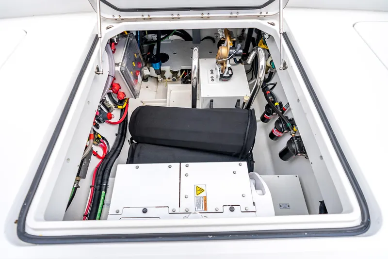 Slide: The Image of Engine compartment of 2024 HCB 42 Lujo boat, showcasing wiring and mechanical components. - 30
