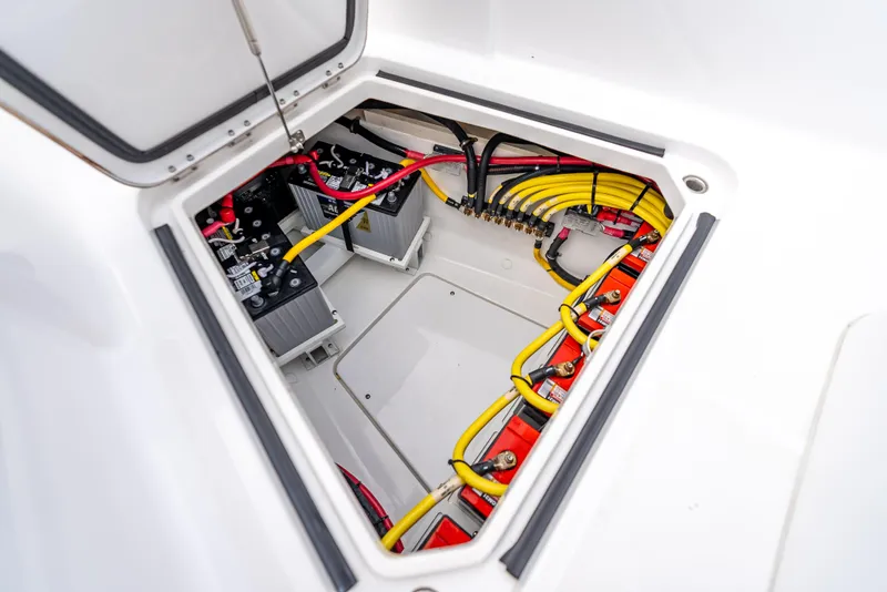 Slide: The Image of Electrical compartment of 2024 HCB 42 Lujo boat with batteries and wiring. - 31