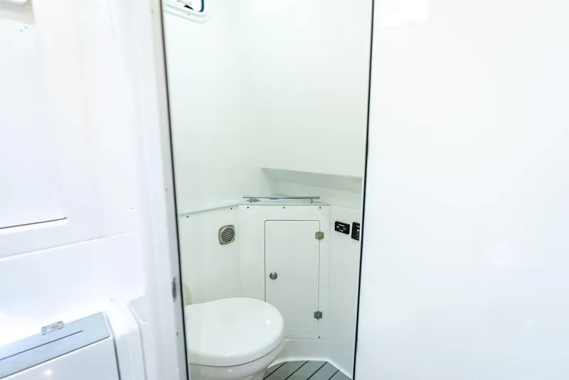 Slide: The Image of 2024 HCB 42 Lujo boat bathroom interior with modern white design. - 34