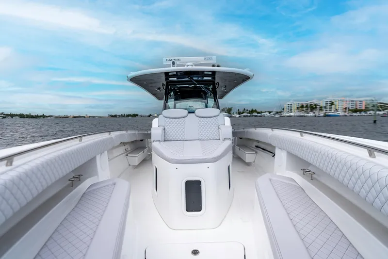 Slide: The Image of 2024 HCB 42 Lujo boat interior with luxurious seating and open water view. - 9