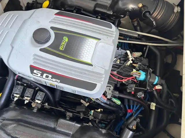 Slide: The Image of Engine of 2011 Sea Ray 205 Sport boat, featuring 5.0 MPI motor. - 13