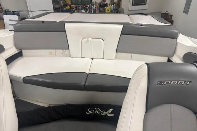 Slide: The Image of 2011 Sea Ray 205 Sport boat interior with gray and white seating, showcasing sleek design. - 29