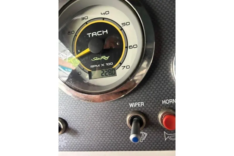 Slide: The Image of Tachometer of 2011 Sea Ray 205 Sport showing 2280 RPM with control switches. - 23